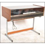 A stunning vintage / retro teak cased Deccasound Compact 3 audio system record player raised on a