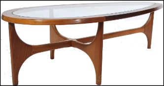 A retro mid 20th century teak wood atomic ' Astro ' lozenge shaped coffee table by G Plan, having