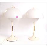 After Verner Panton - Panthella - A 1970's vintage pair of tall white plastic formed lamps having