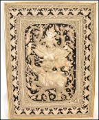 A large 20th century needlepoint relief worked Indian / Asiatic panel. Gilded and white metal