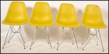 After Charles and Ray Eames - A set of four Vitra style DSR plastic injection moulded shell chairs