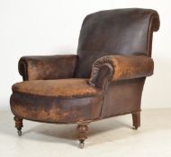 A stunning English Victorian antique leather club chair / armchair being stuffed and sprung with