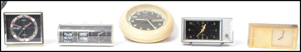 A collection of five retro vintage 20th Century wall clocks and desktop clocks to include one in the