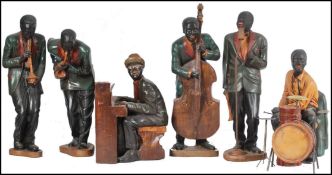 A good 20th century New Orleans negro jazz band figure group. 6 in total to include pianist,