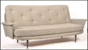 Vono - A 1950's vintage sofa bed having a metal and sprung frame with angular armrests finished in