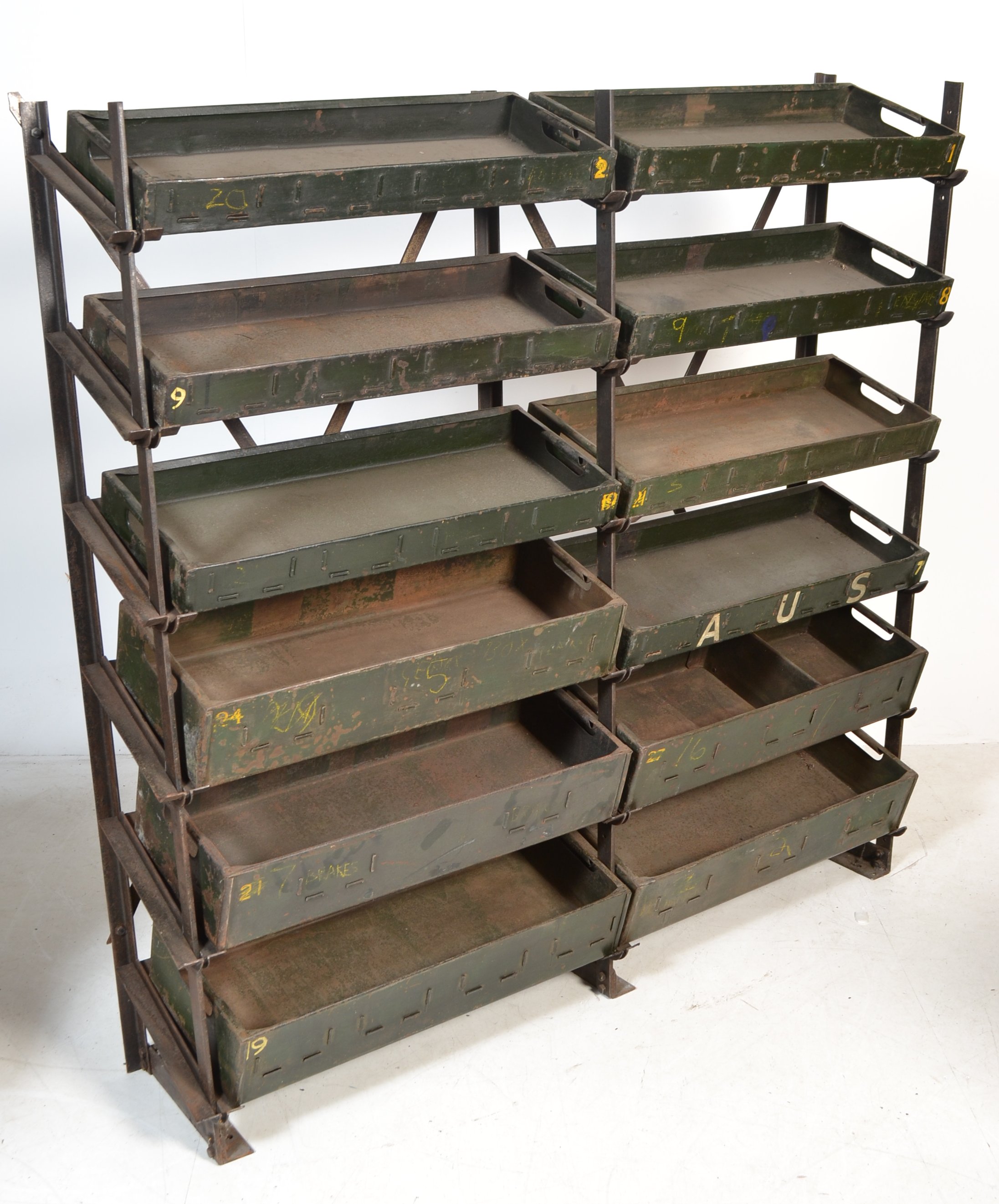 A vintage industrial metal storage rack unit having a ' x ' frame support and 12x angled slopes - Image 2 of 5