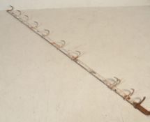 A stunning mid Century multiple hook set of Butchers hooks cast in steel, the hooks having the