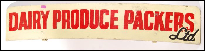 A large 1970's retro vintage hand painted sign for Dairy Produce Packers LTD being arched with white