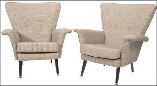 Vono - A 1950's vintage pair of matching high back armchairs having wide angled back rests and
