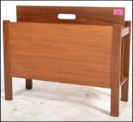 A 1970's Danish teak wood retro magazine rack - Canterbury by Guy Rogers. The panelled body with