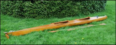 A vintage marine ply double seater canoe by Moonraker Canoes Jenkins and Lancefield Corsham