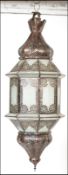 A large Moroccan hanging Berber lantern. Pierced metal construction adorned with individual smoked