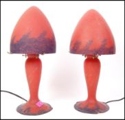 After Emile Galle - A pair of Art Nouveau style glass desk / table lamps in a matt crimson red and