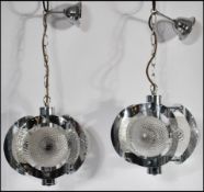 A mid 20th Century pair of wall hanging ceiling chandelier / lights having a central  polished