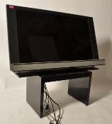 Bang & Olufsun - A retro 20th century flatscreen television and matching stand. The Tv with black