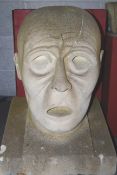 A large abstract carved Bath stone sculpture bust of a shocked stylised gentleman.