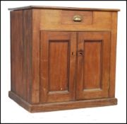 An early 20th Century vintage industrial oak shop pedestal haberdashery / cashiers counter having