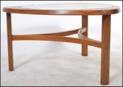 A retro teak wood atomic ' Astro ' triangular coffee table by G Plan, having a drop centre glass