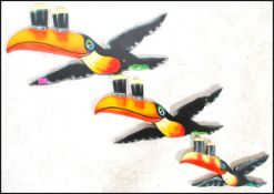 A group of three large advertising point of sale bar / pub graduating Guinness toucans of wooden