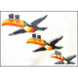 A group of three large advertising point of sale bar / pub graduating Guinness toucans of wooden