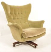 G-Plan - Model 6250 - A 1960's retro vintage large wing back swivel chair / armchair upholstered