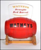 A vintage retro 20th century Watneys Draught Red Barrel" bar top advertising light display. Raised