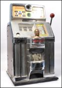 A 1950s American " Sixpence-in-the-Slot " " Governor - Tic-Tac-Toe " One Armed Bandit by