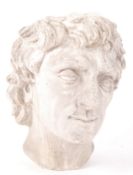 A 20th Century Neo Classical plaster cast head / bust of Apollo, the Greek God of Music. Measures