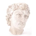 A 20th Century Neo Classical plaster cast head / bust of Apollo, the Greek God of Music. Measures