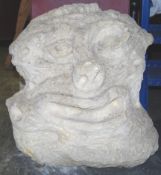 A large abstract carved Bath stone sculpture bust of a deformed stylised human head.