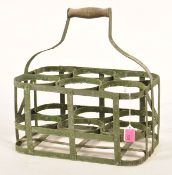 A vintage 20th Century galvanised bottle carrier, the carrier painted green and having six sectional