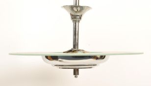 An Art Deco style retro minimalist ceiling light fixture in chrome having frosted glass between