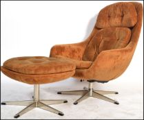 A vintage 20th Century Scandinavian golden burnt orange / brown upholstered swivel button back pod