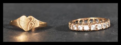 A 9ct gold and white stone eternity ring together