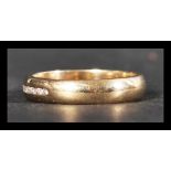 A hallmarked 9ct gold and diamond band ring having