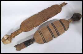 A pair of tribal Africal ceremonial staffs having