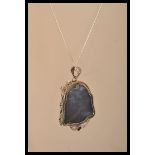 A sterling silver and rock crystal necklace pendan