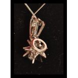 An 18ct white gold necklace pendant in the form of