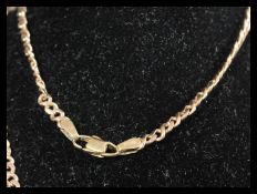 A hallmarked 9ct gold curb chain necklace having a