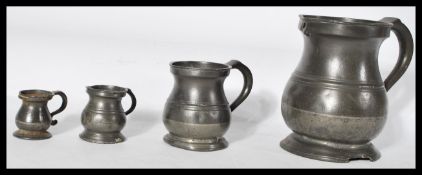 A set of four 18/19th century graduating pewter me