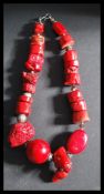 A large coral necklace of baroque form having larg