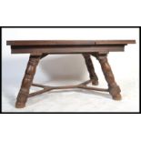 A large 1930's oak refectory dining table being ra