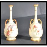 A pair of Royal Worcester blush ivory vases, decor