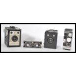 A group of vintage cameras to include a Bolex supe