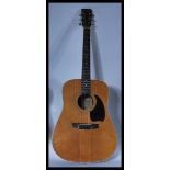 Two 20th Century acoustic six string guitars to in