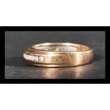 A hallmarked 9ct gold and diamond half eternity ri