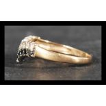 A hallmarked 9ct gold wishbone ring set with sapph