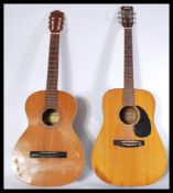 Two vintage retro 20th century acoustic guitars on
