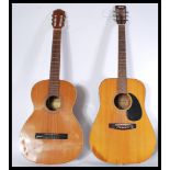 Two vintage retro 20th century acoustic guitars on