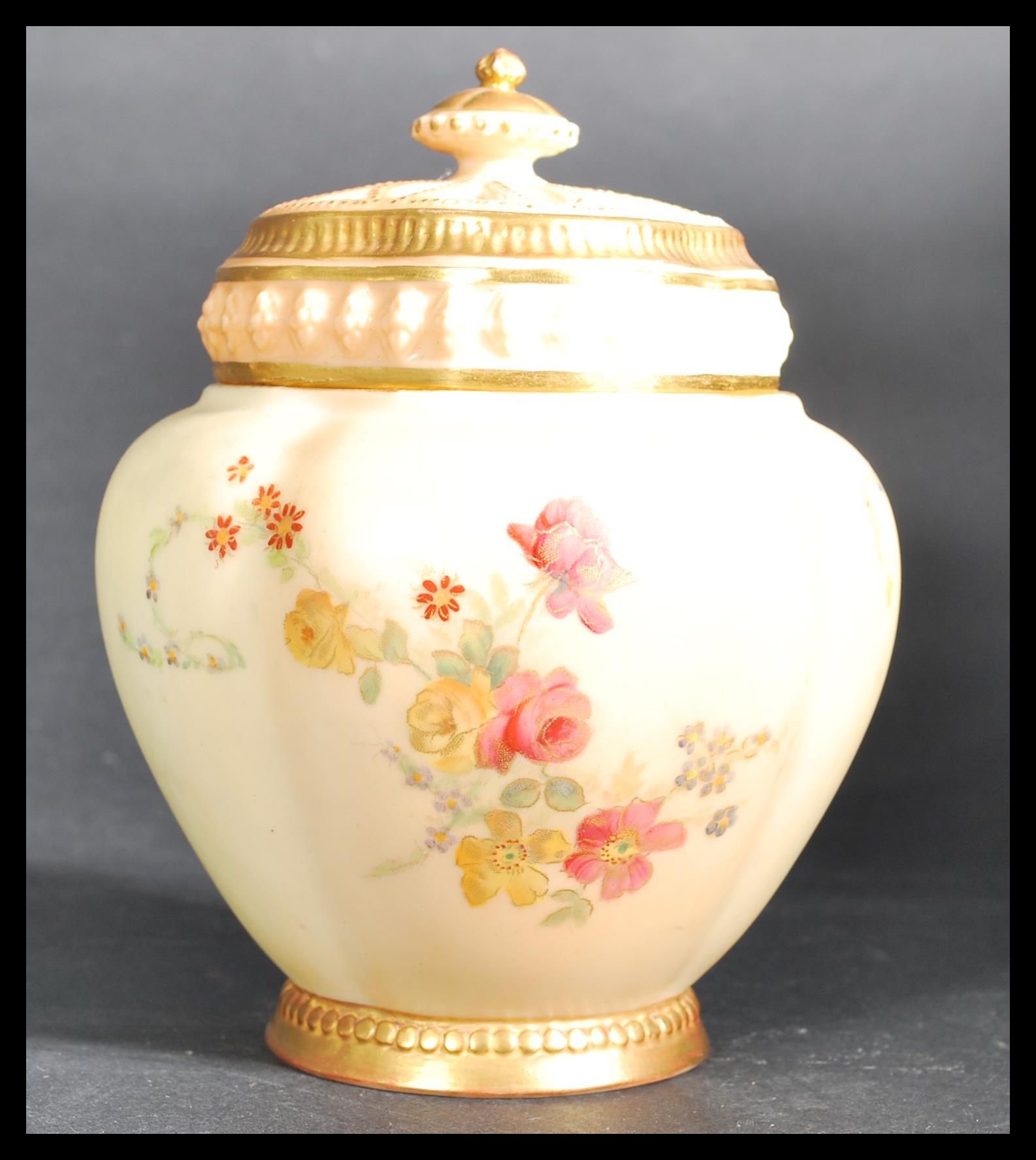 A Royal Worcester quarter lobed gilded ivory blush